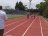 Steven González, Ministro de Educacion observa carrera en la pista de 100 metros
