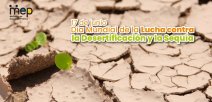 Imagen de una tierra seca con una poca vegetación.